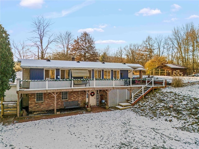 view of snow covered house