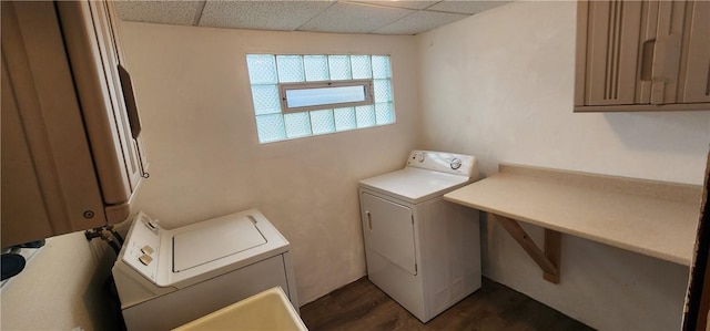 clothes washing area featuring independent washer and dryer and dark wood-type flooring