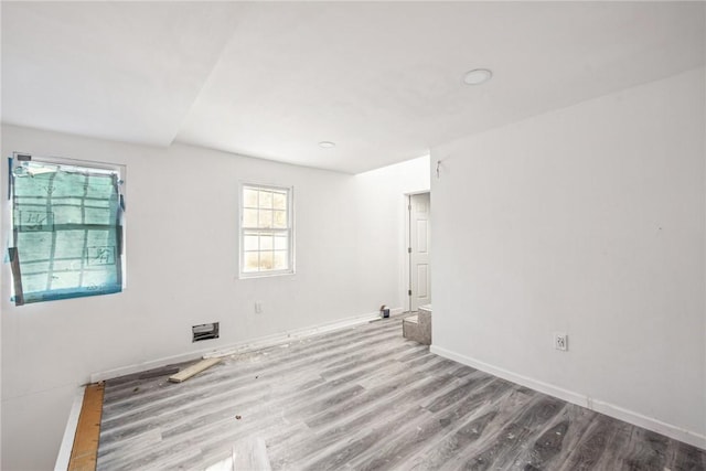 unfurnished room with light hardwood / wood-style flooring