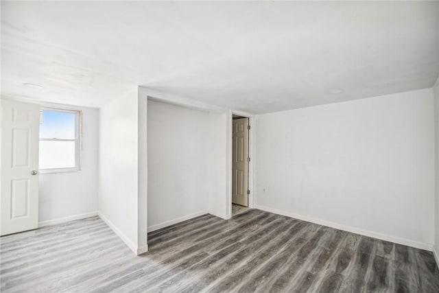 spare room featuring hardwood / wood-style floors