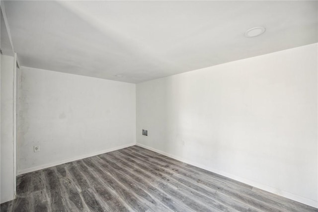 spare room featuring hardwood / wood-style flooring