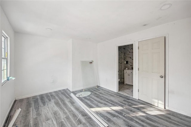 spare room featuring hardwood / wood-style floors