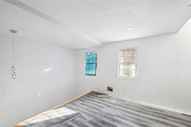 empty room with wood-type flooring