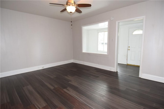 foyer with ceiling fan and dark hardwood / wood-style flooring