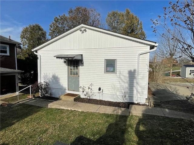 rear view of house with a lawn