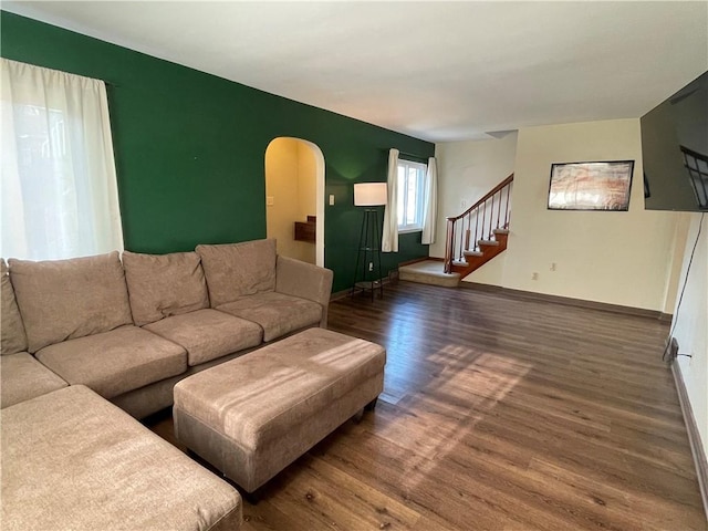 living room with dark hardwood / wood-style flooring