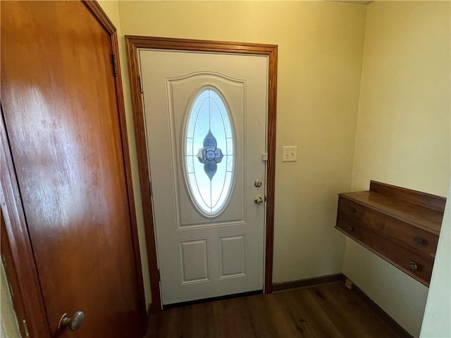 entryway with dark hardwood / wood-style flooring