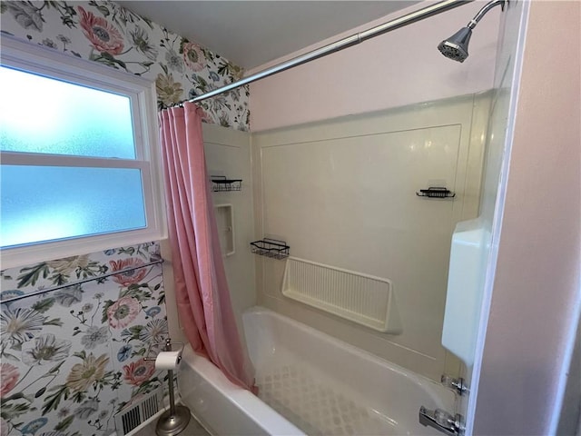 bathroom featuring shower / bathtub combination with curtain