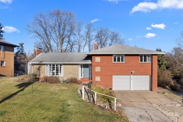 view of front of house with a front yard and a garage