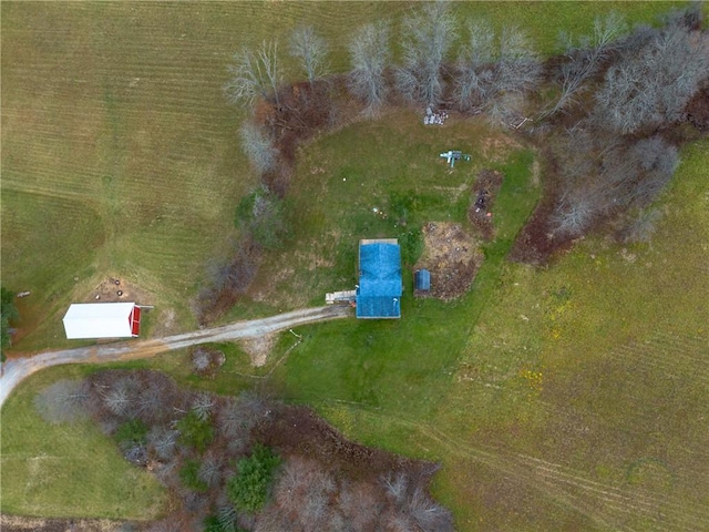 birds eye view of property with a rural view