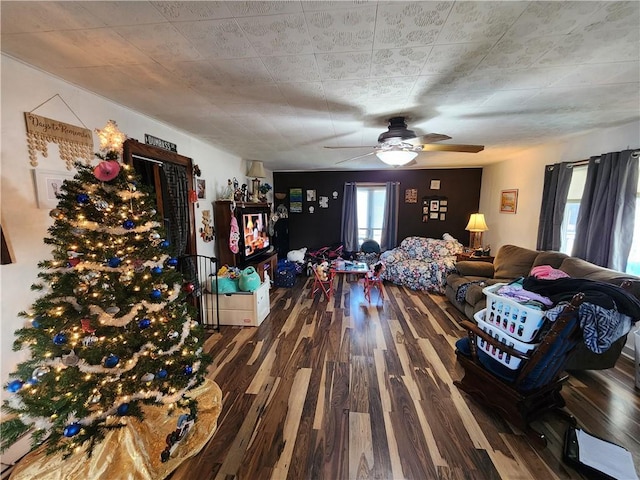 interior space featuring ceiling fan and dark hardwood / wood-style floors