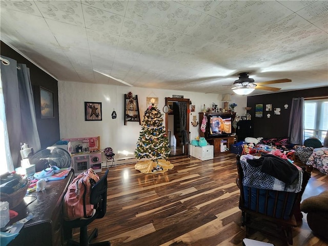 living room with ceiling fan and dark hardwood / wood-style flooring