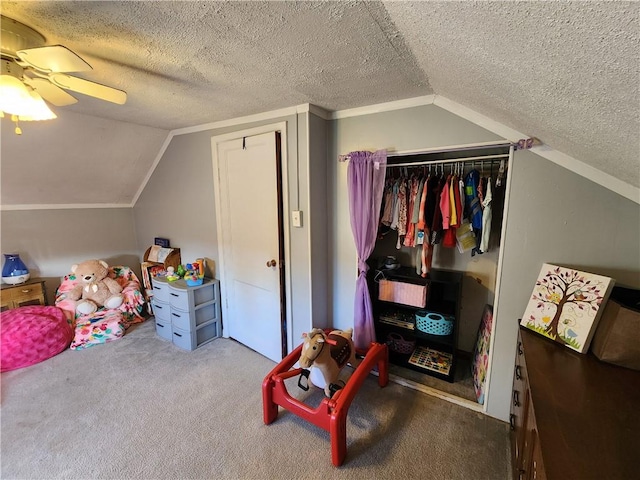 bedroom with carpet flooring, ceiling fan, a textured ceiling, and vaulted ceiling