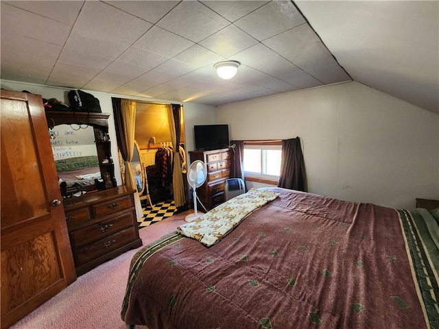 carpeted bedroom featuring vaulted ceiling