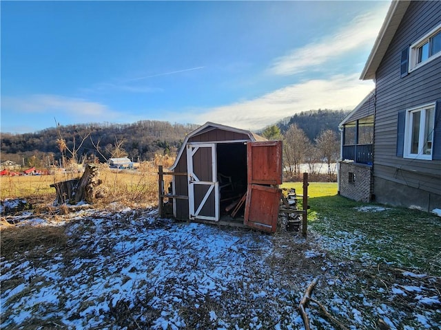 view of outbuilding with a yard