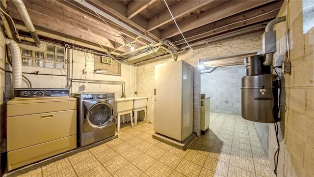 washroom with independent washer and dryer