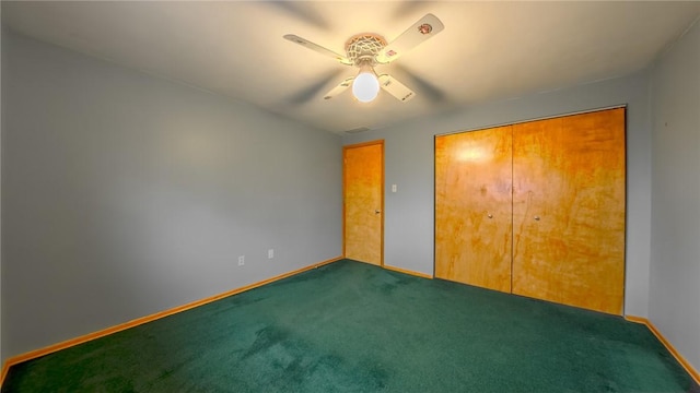 unfurnished bedroom featuring carpet, ceiling fan, and a closet