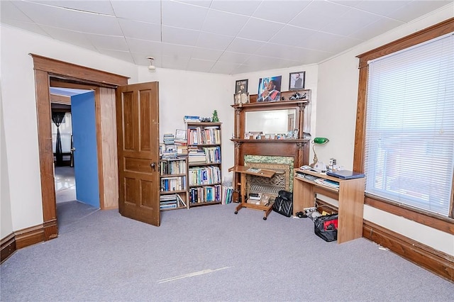 carpeted office featuring crown molding