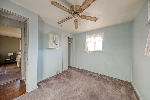 bedroom with carpet flooring, ceiling fan, and a closet