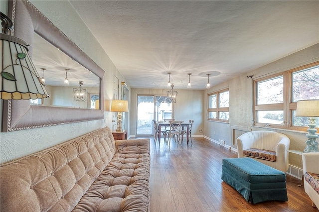 living room featuring hardwood / wood-style floors and a textured ceiling