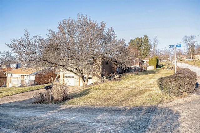 exterior space with a garage and a front yard