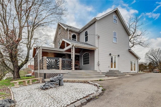 back of property featuring french doors