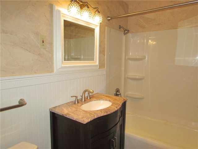 bathroom with bathtub / shower combination and vanity