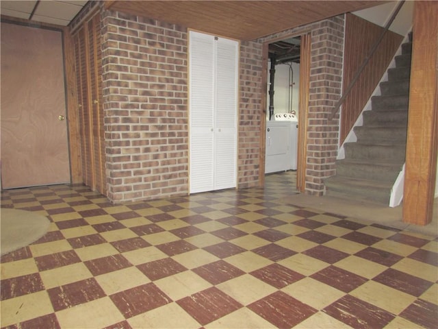 basement with brick wall