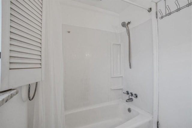 bathroom with shower / bath combination