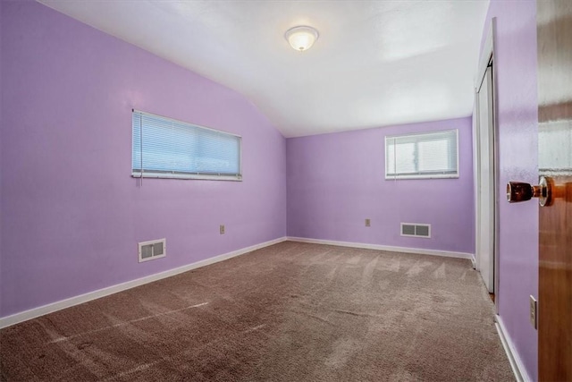 additional living space with carpet floors and lofted ceiling