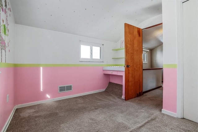 bonus room featuring light colored carpet and lofted ceiling