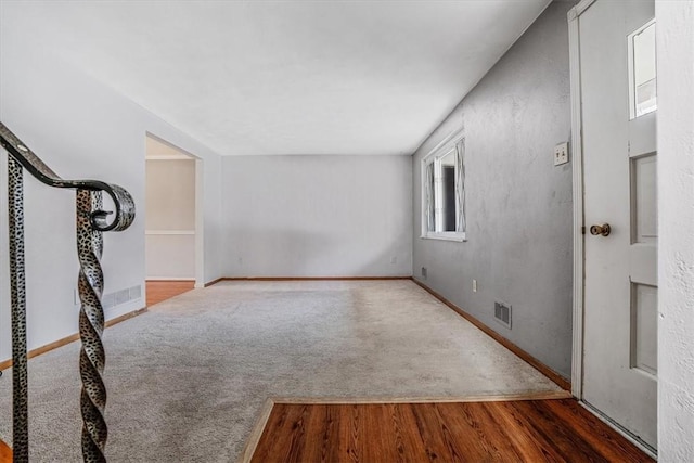 empty room featuring dark wood-type flooring