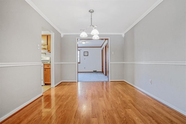 unfurnished dining area featuring light hardwood / wood-style floors, a notable chandelier, and ornamental molding