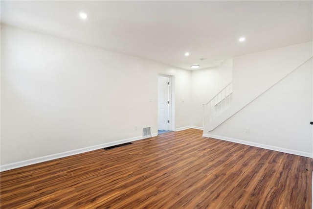 basement featuring dark hardwood / wood-style floors