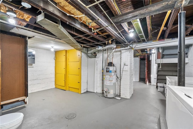 basement featuring washer / clothes dryer and water heater