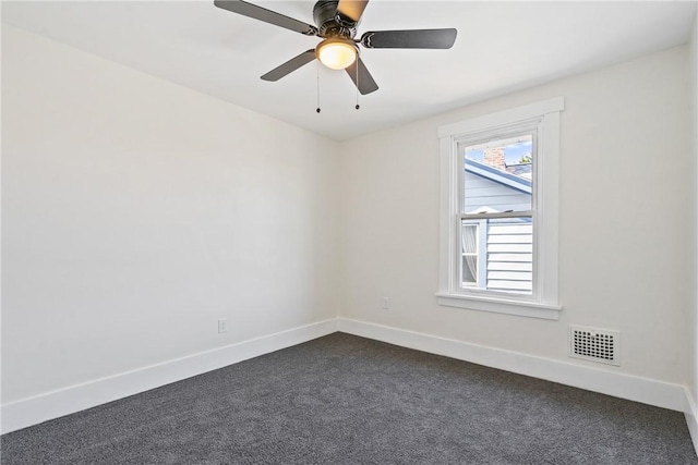 carpeted spare room featuring ceiling fan