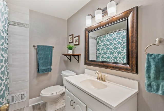 bathroom with vanity, hardwood / wood-style flooring, and toilet