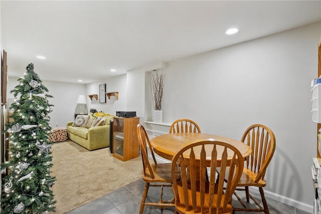 dining area with light colored carpet