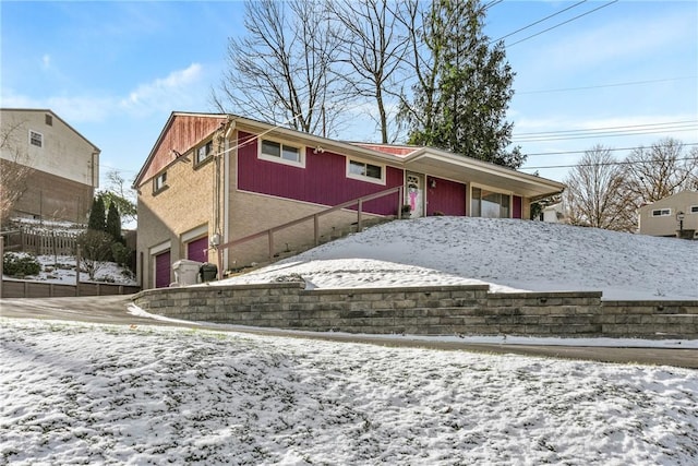 view of front of property with a garage