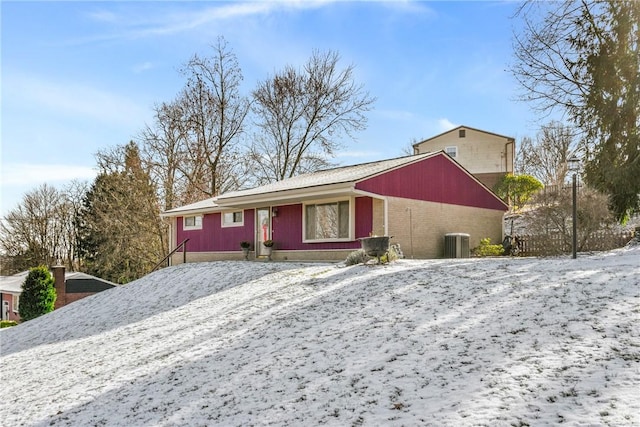 ranch-style home with central air condition unit