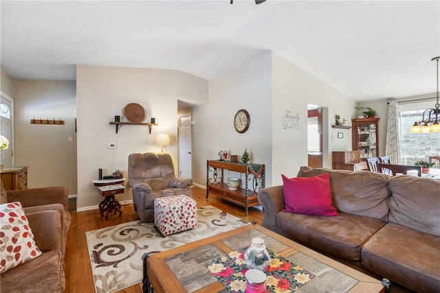 living room with dark hardwood / wood-style flooring and lofted ceiling