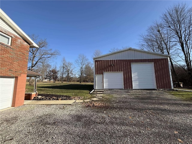 garage featuring a yard