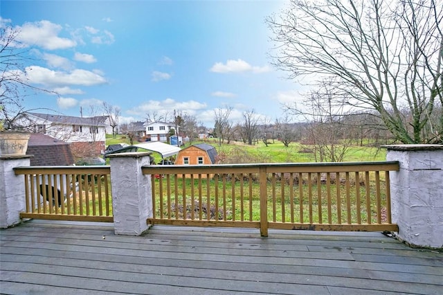 wooden deck featuring an outbuilding