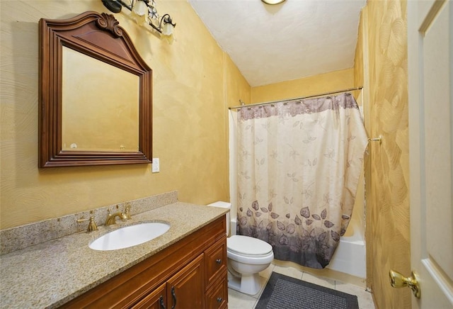 full bathroom featuring tile patterned floors, shower / bath combo with shower curtain, vanity, and toilet