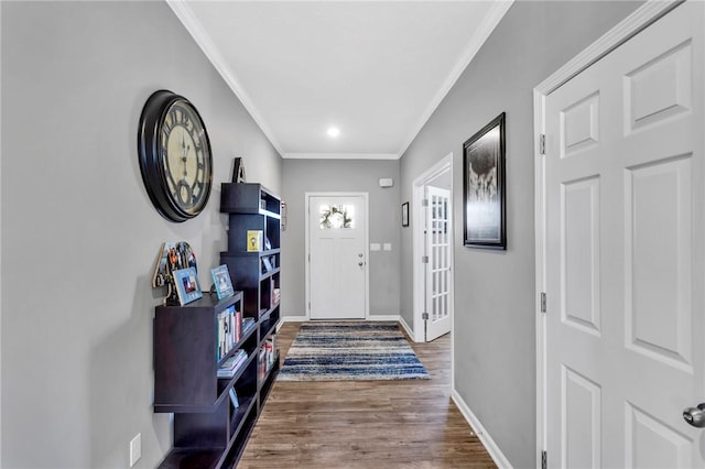 foyer entrance with wood-type flooring and ornamental molding