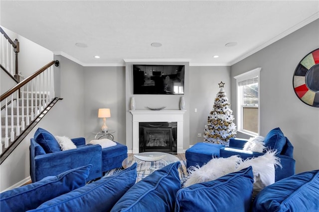 living room featuring hardwood / wood-style flooring and ornamental molding