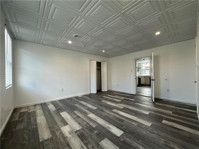 unfurnished room featuring dark hardwood / wood-style floors