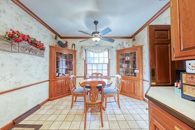 dining area featuring crown molding, ceiling fan, and light tile patterned floors