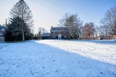 view of yard covered in snow