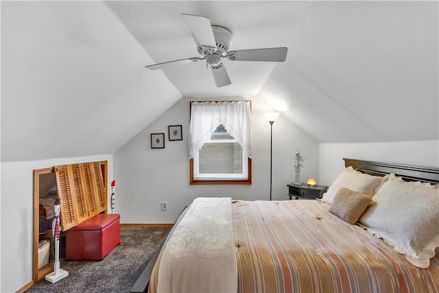 carpeted bedroom featuring ceiling fan and lofted ceiling